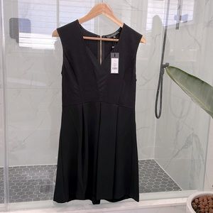 Black Sleeveless dress from DYNAMITE. Never been worn. Size SMALL